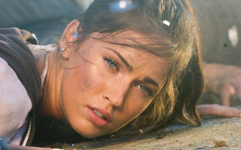 woman lying on ground after explosion