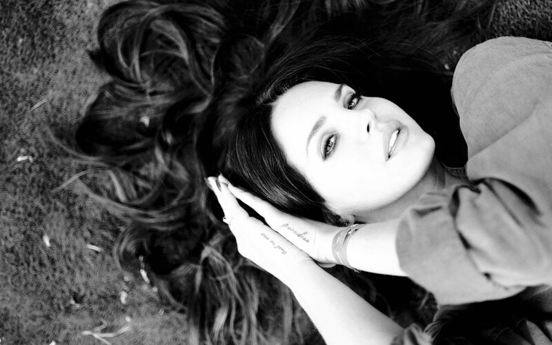 Woman Lying on Ground — Black, Contemplative, Photograph