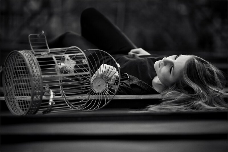Woman Lying on Ground — Black, Dramatic, Photograph, Birdcage