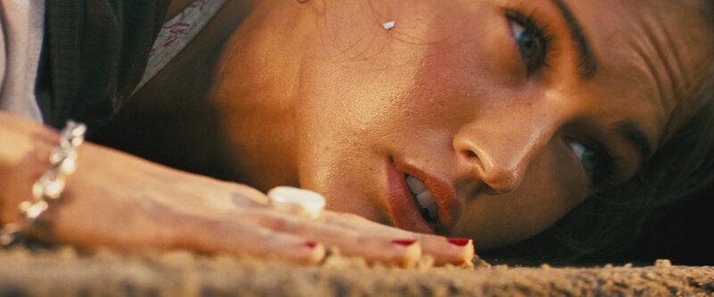 woman lying on ground in distress