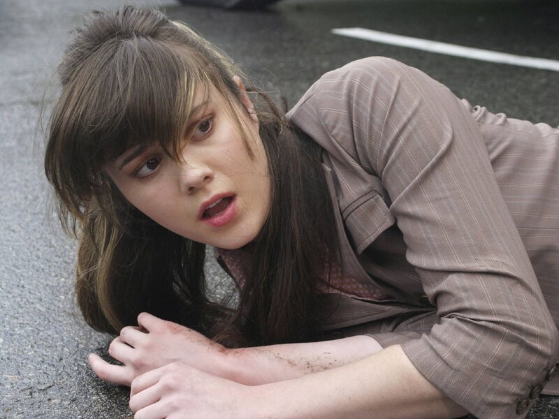 woman lying on ground in distress