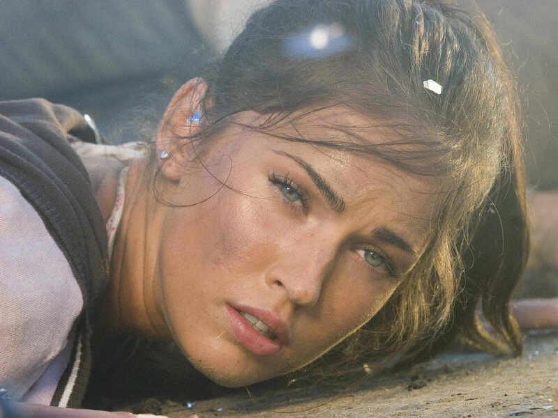 woman lying on ground looking up