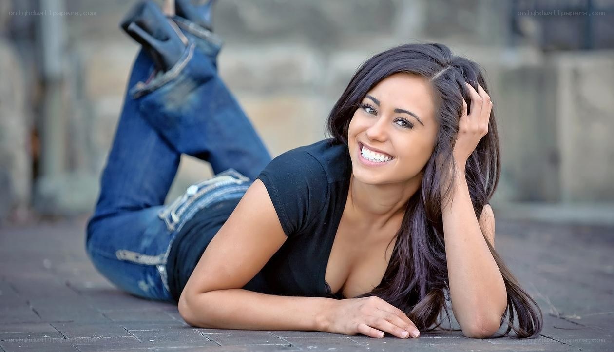 woman lying on ground smiling