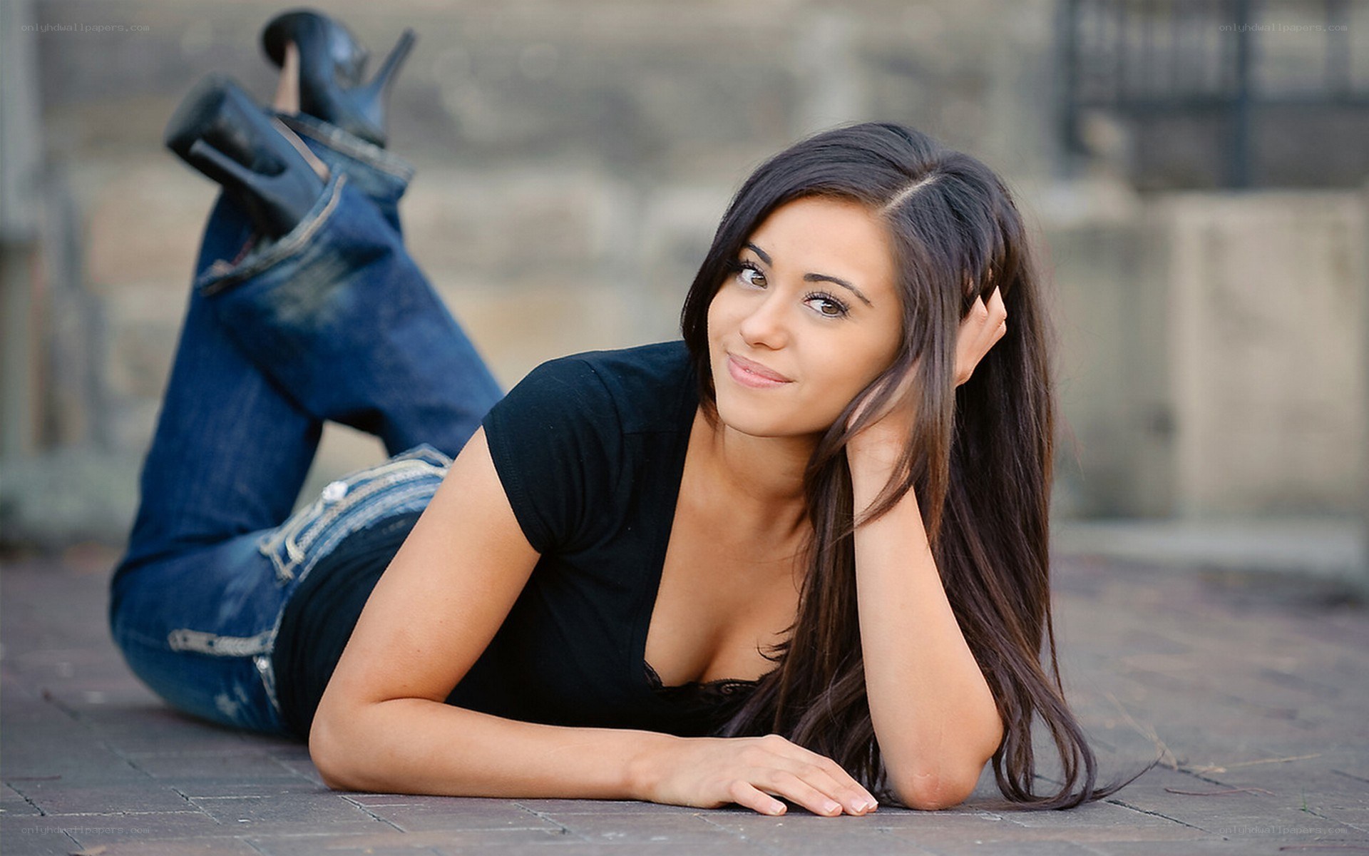 woman lying on ground smiling