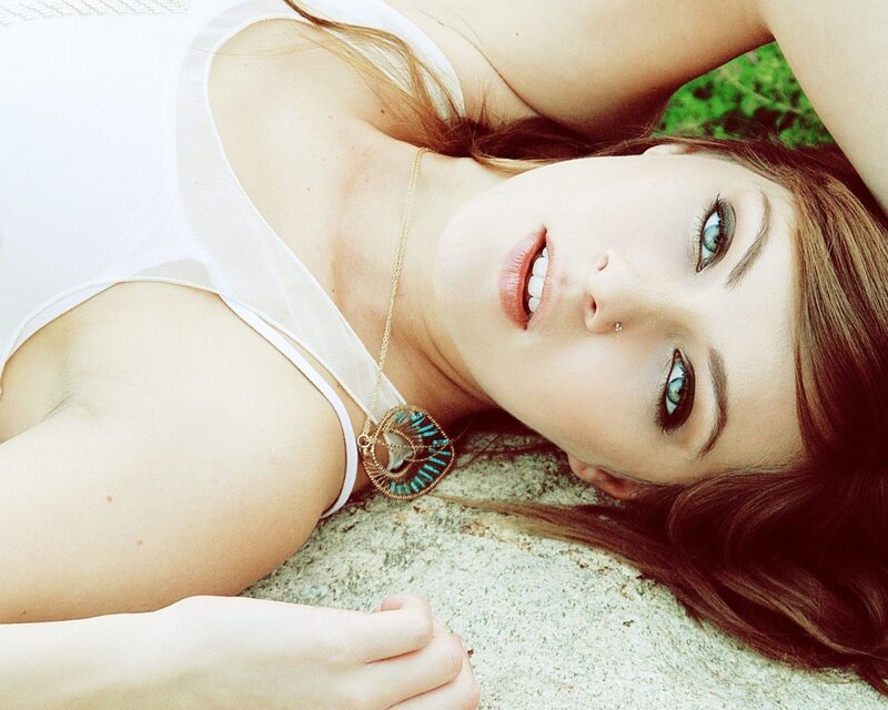woman lying on ground smiling