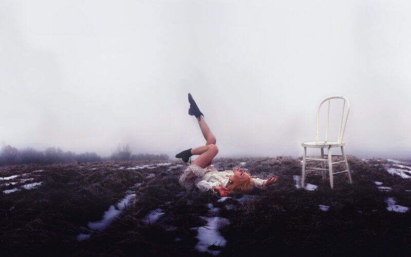 Woman Lying on Ground — White, Melancholic