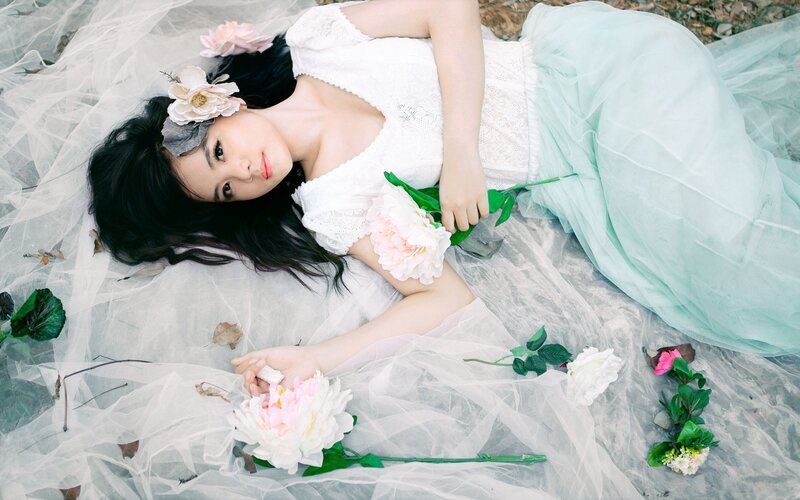 Woman Lying on Ground — White, Serene, Spring