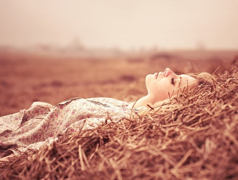 Woman Lying on Hay — Brown, Serene