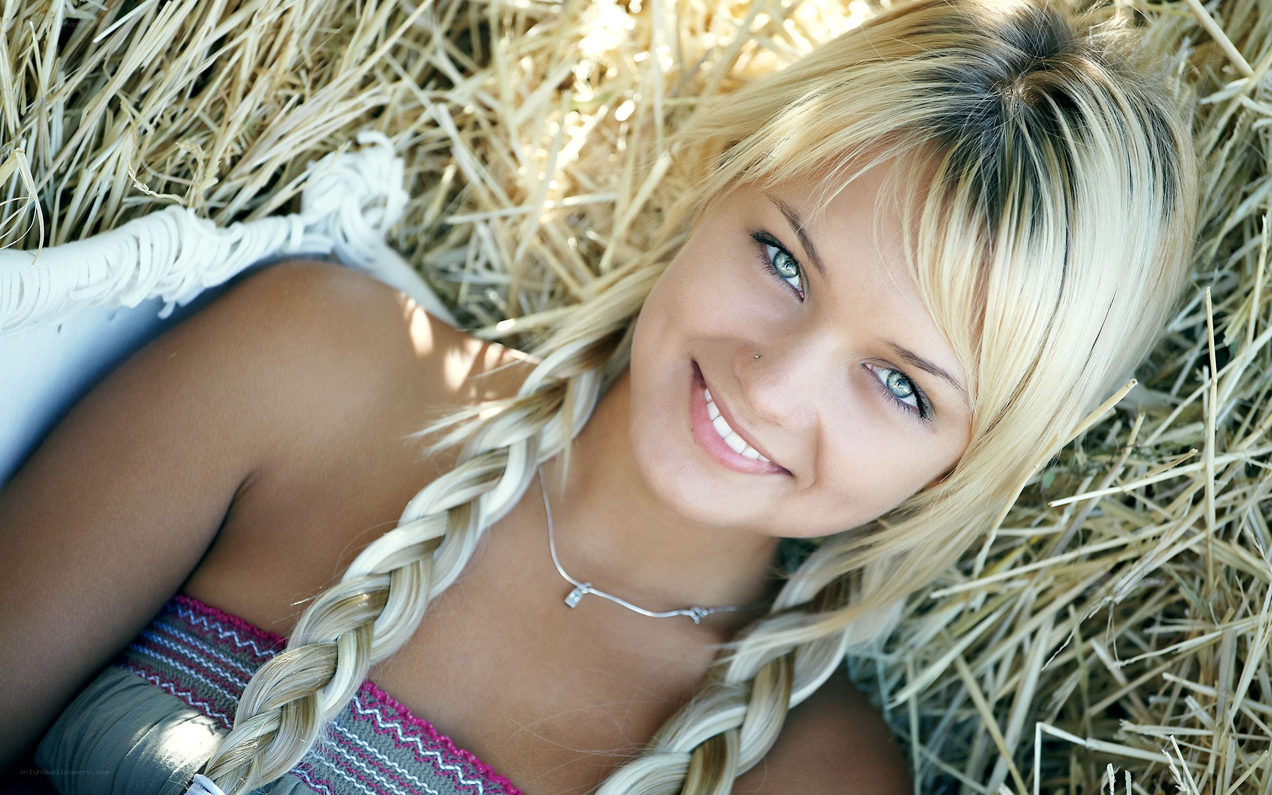 woman lying on hay