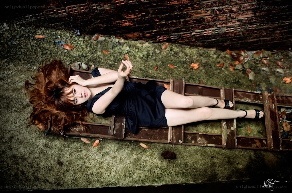 woman lying on ladder