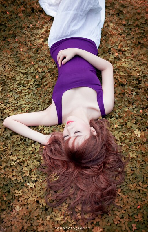 woman lying on leaves