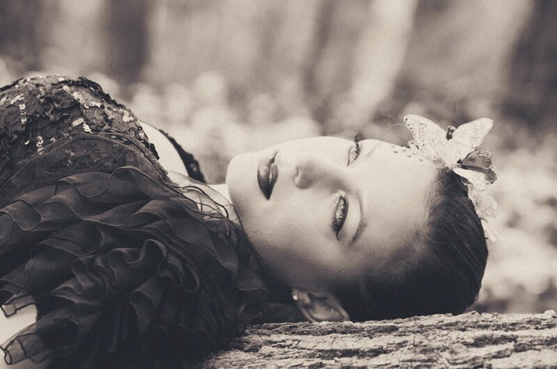 Woman Lying on Log — Black, Serene