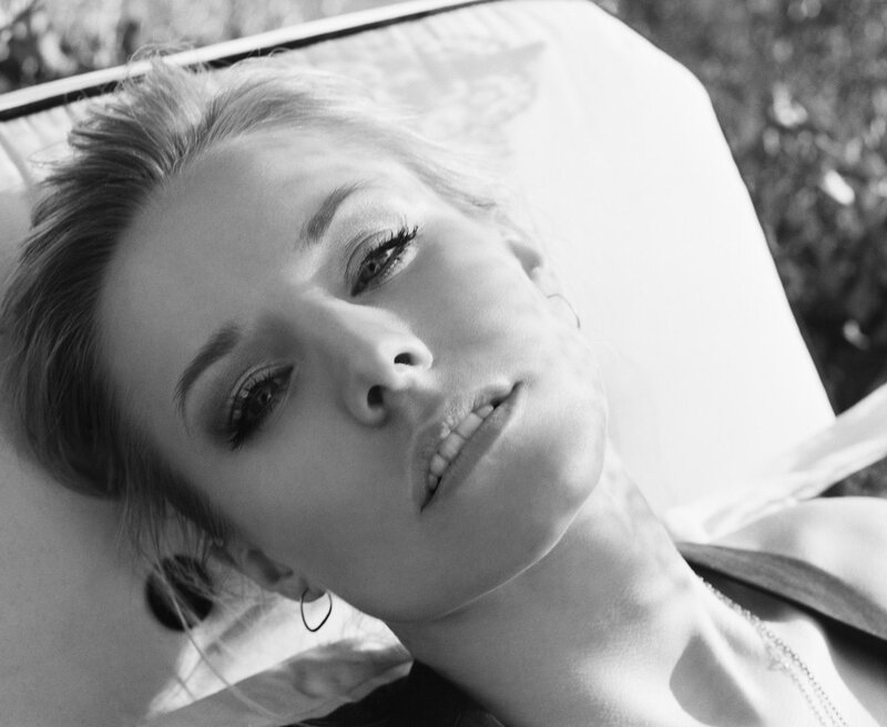 woman lying on lounge chair