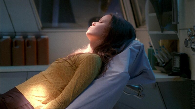 woman lying on medical bed