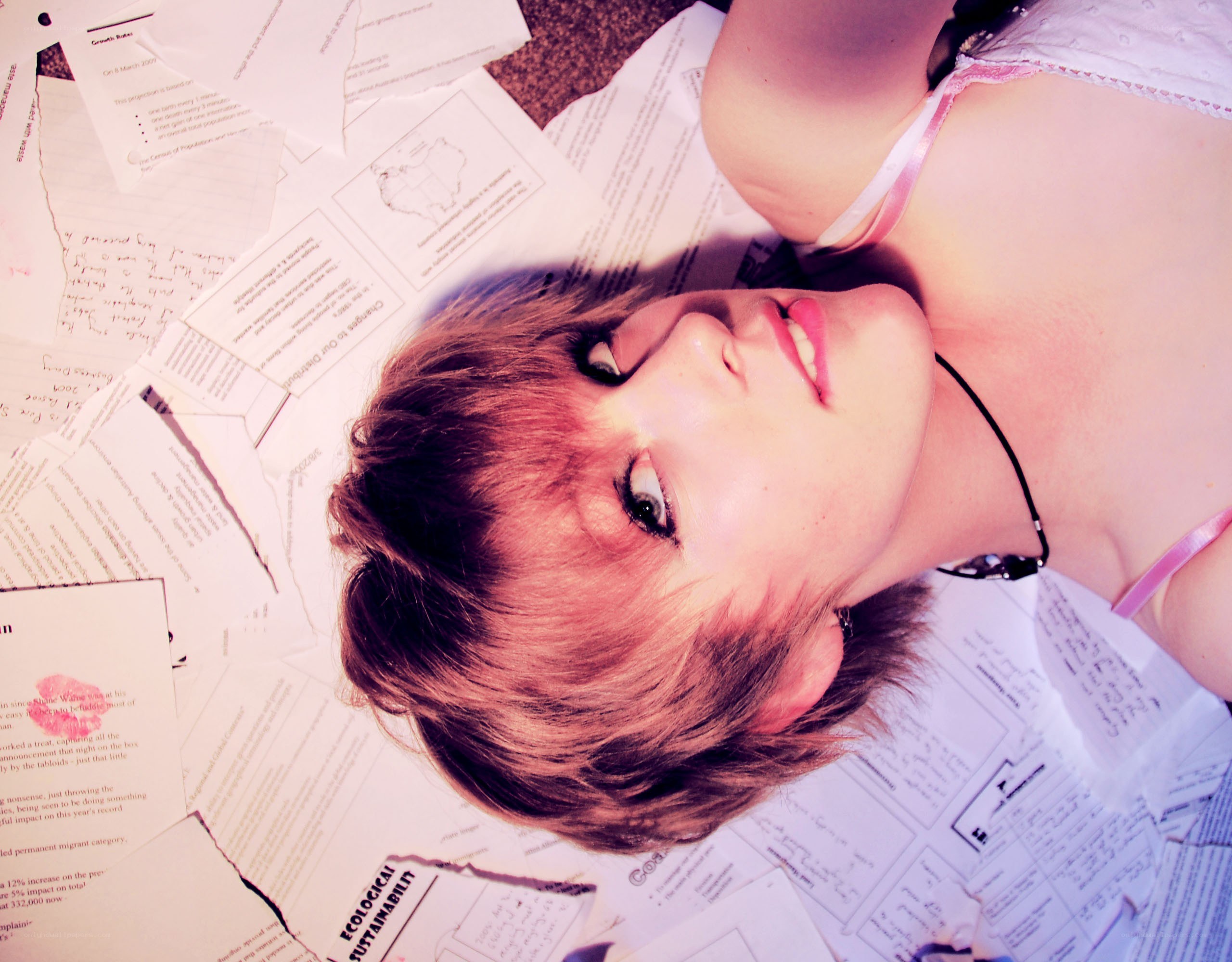 woman lying on papers