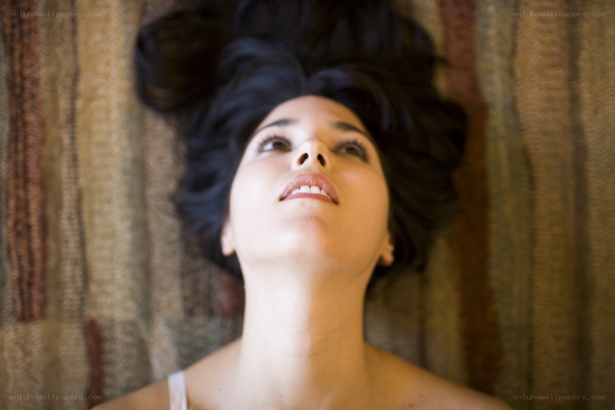 woman lying on patterned fabric