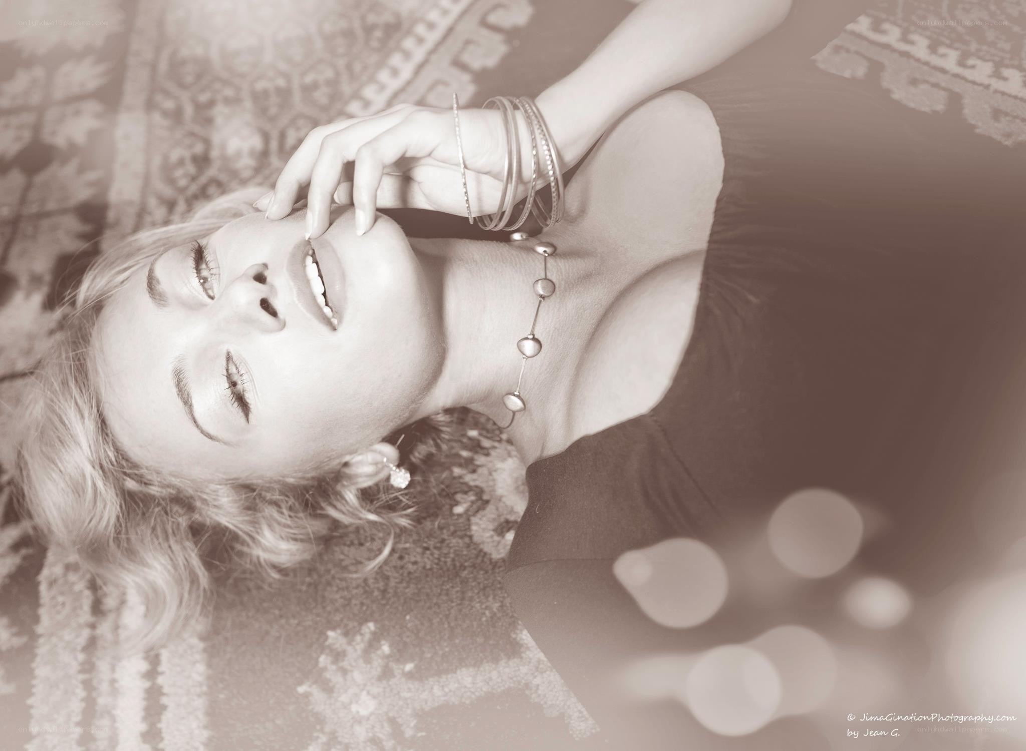 woman lying on patterned rug