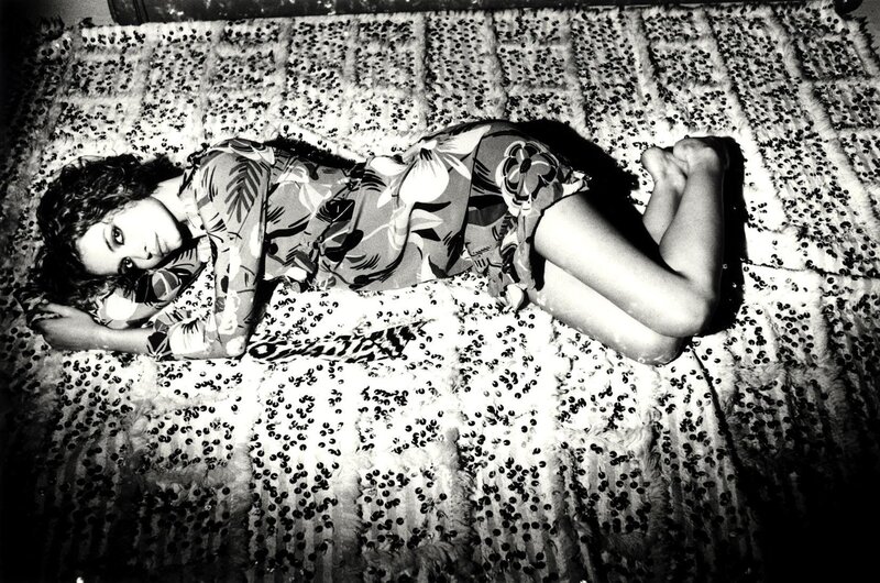 Woman Lying on Patterned Rug — Black