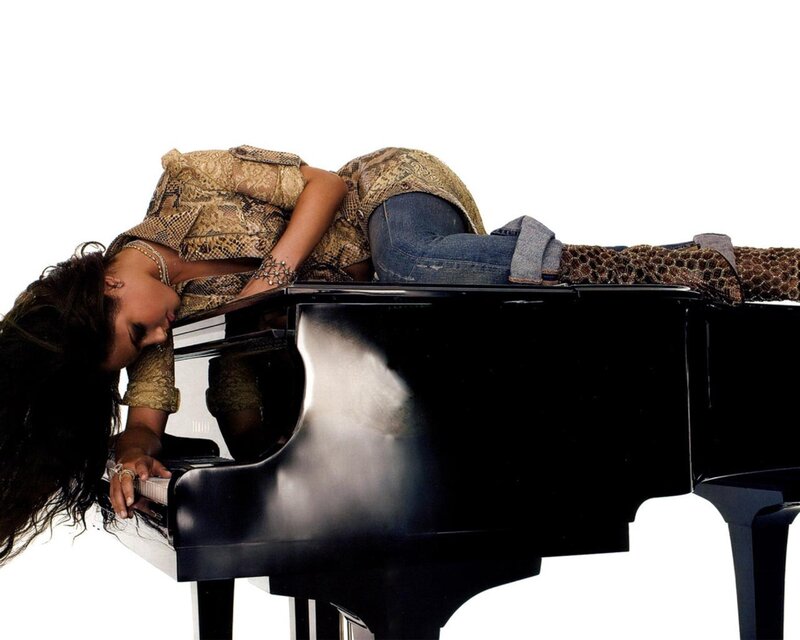 woman lying on piano