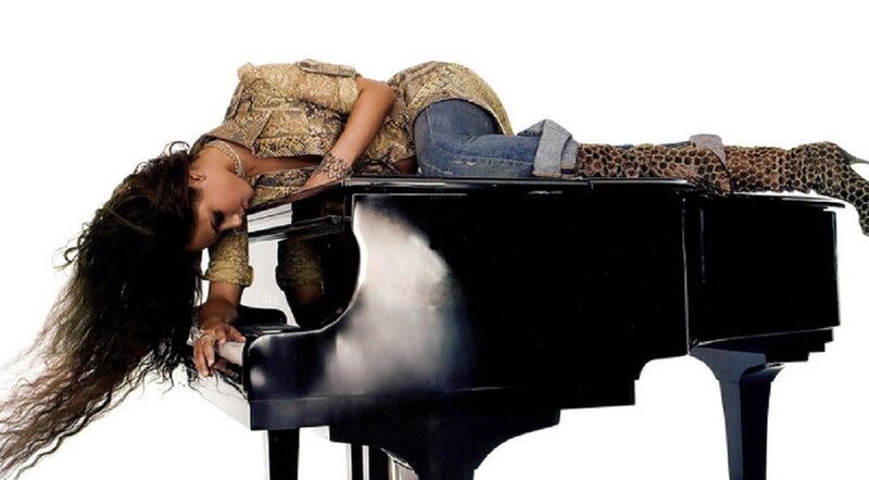woman lying on piano