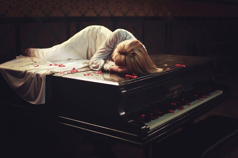 Woman Lying on Piano — Black, Dramatic, Photograph, Rose Petals
