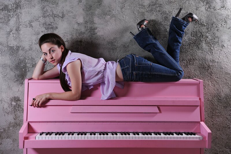 Woman Lying on Piano — Pink