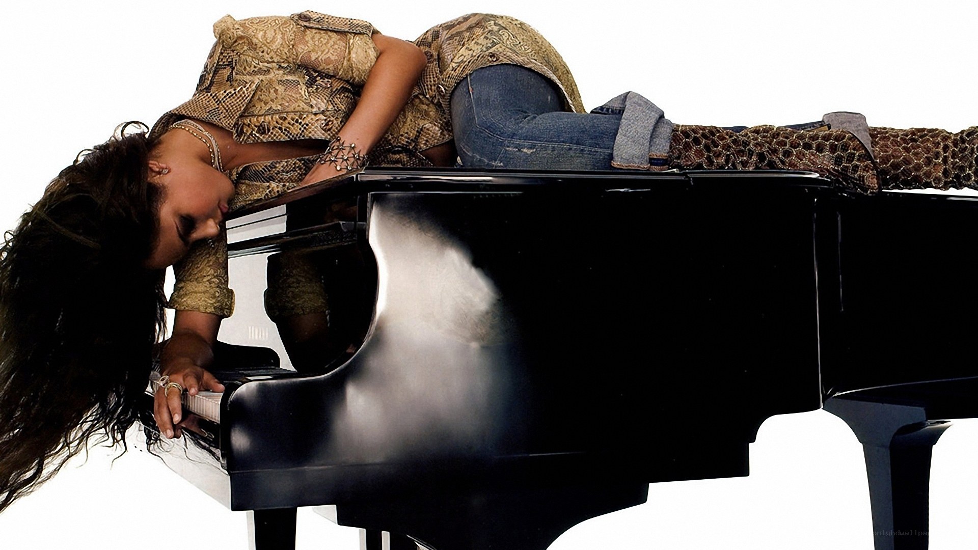 woman lying on piano