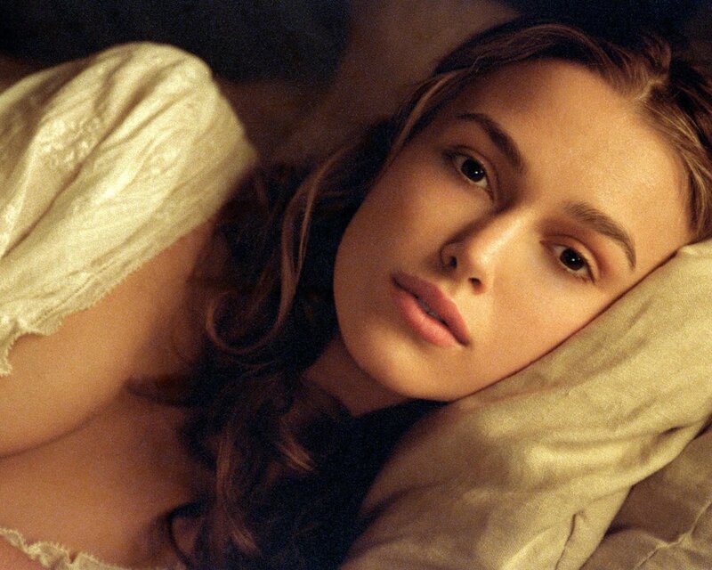 woman lying on pillow