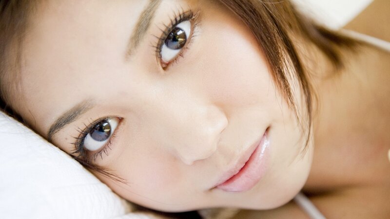 woman lying on pillow