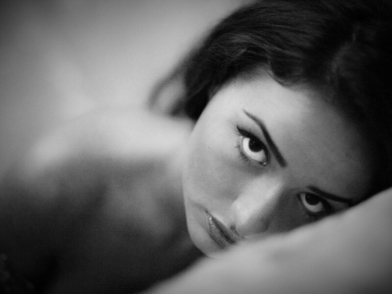 Woman Lying on Pillow — Black, Intense