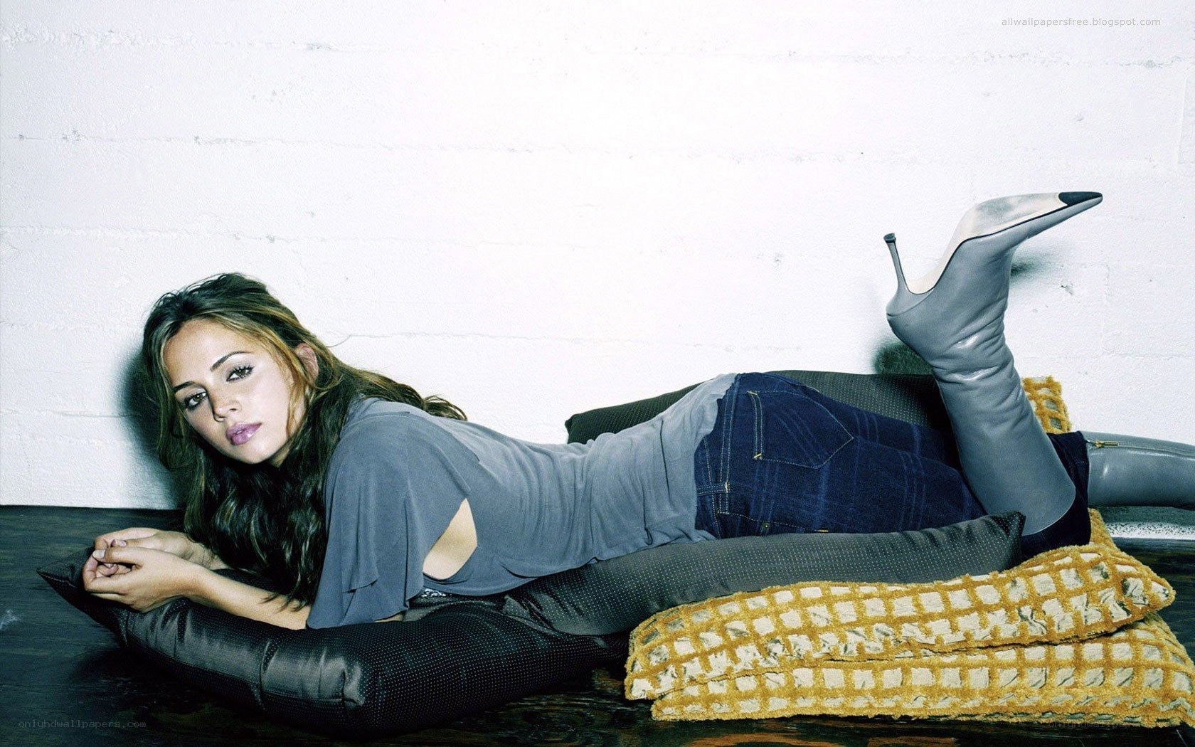 woman lying on pillows