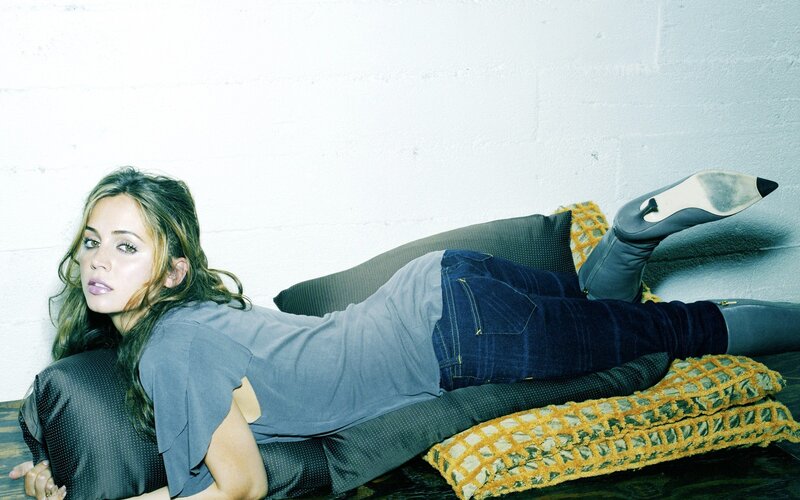 Woman Lying on Pillows — Gray