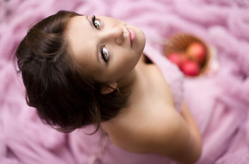 Woman Lying on Pink Fabric — Calm, Photograph, Apples