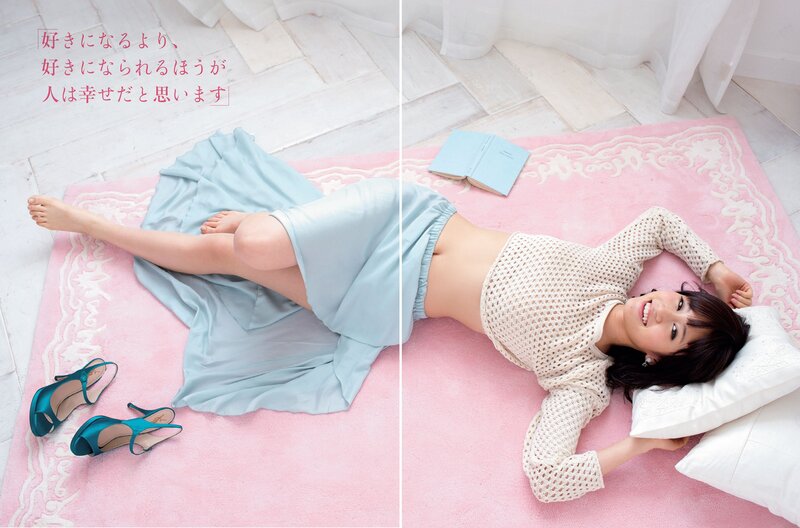 woman lying on pink rug