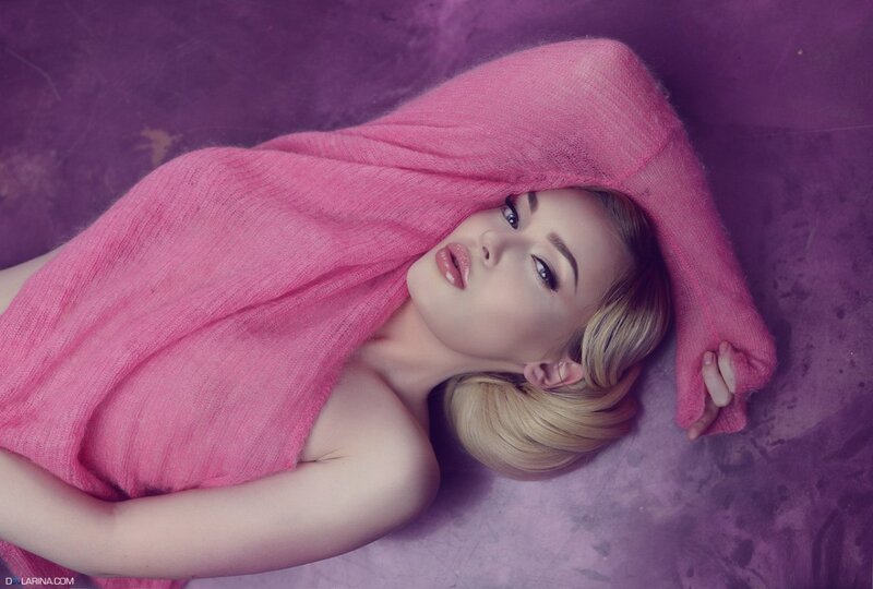 Woman Lying on Purple Floor — Dramatic