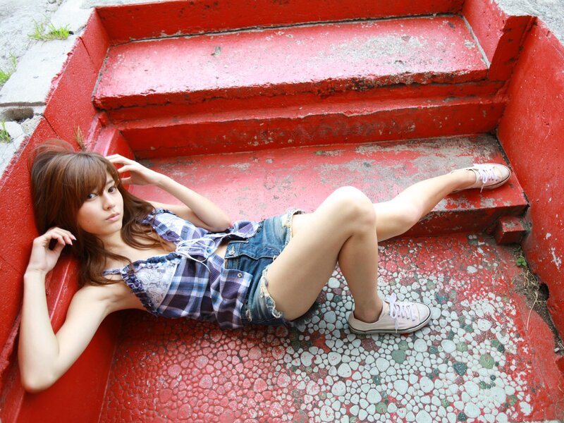 woman lying on red stairs