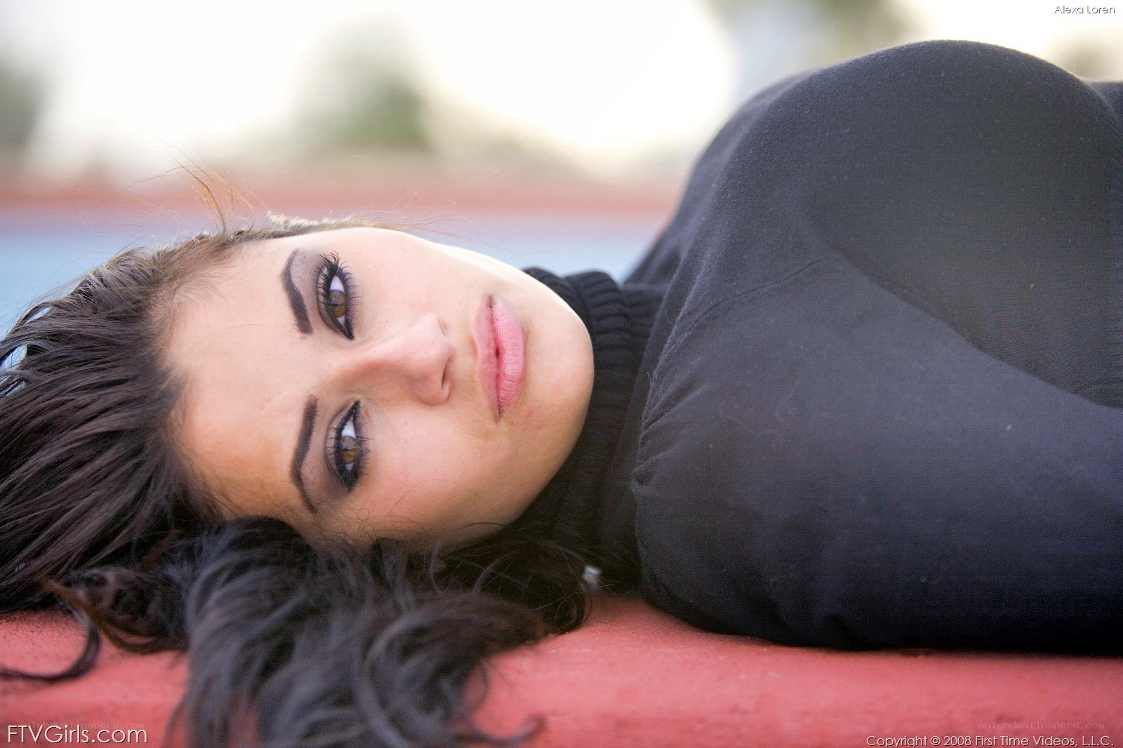 woman lying on red surface