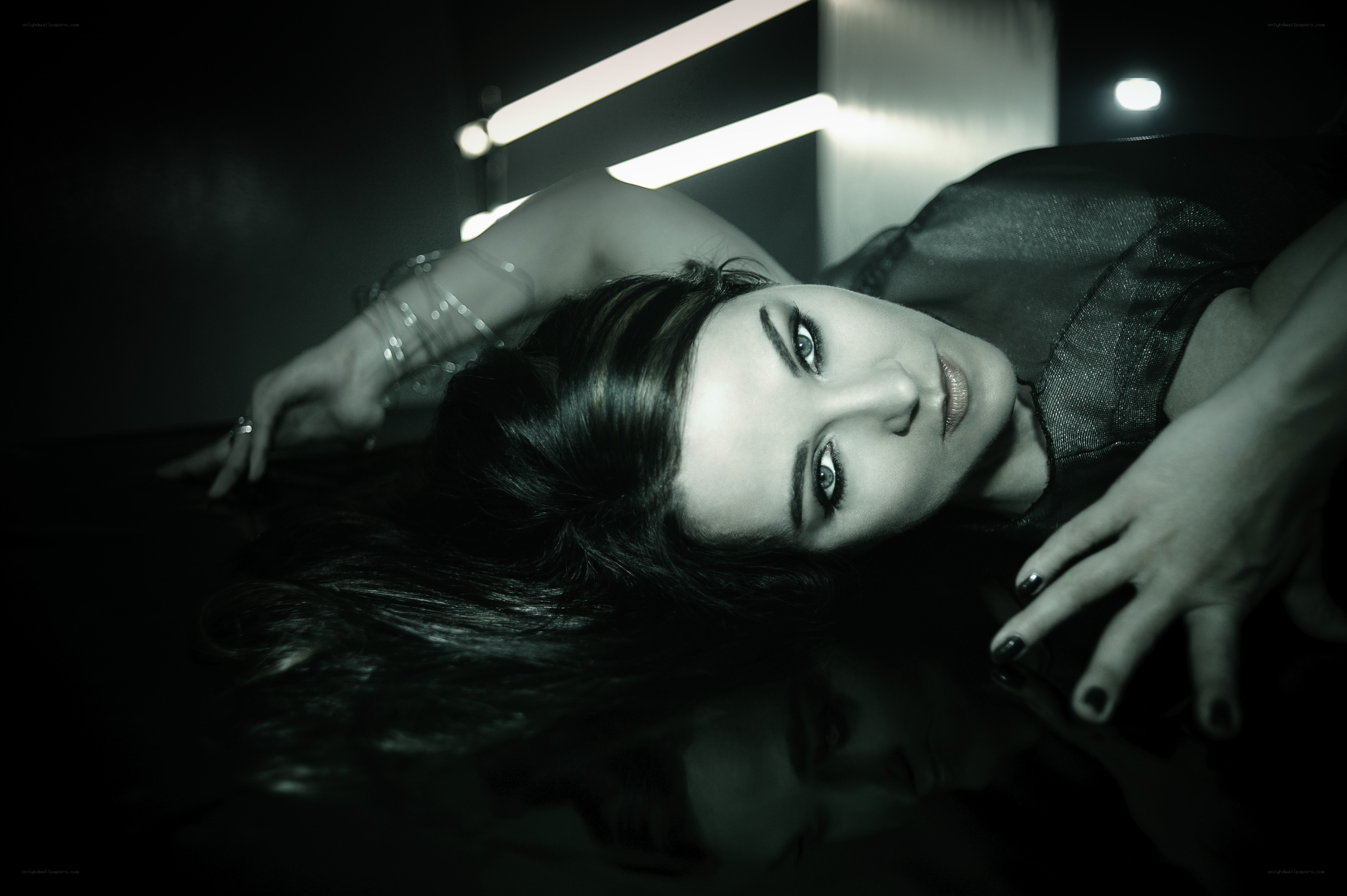 woman lying on reflective surface