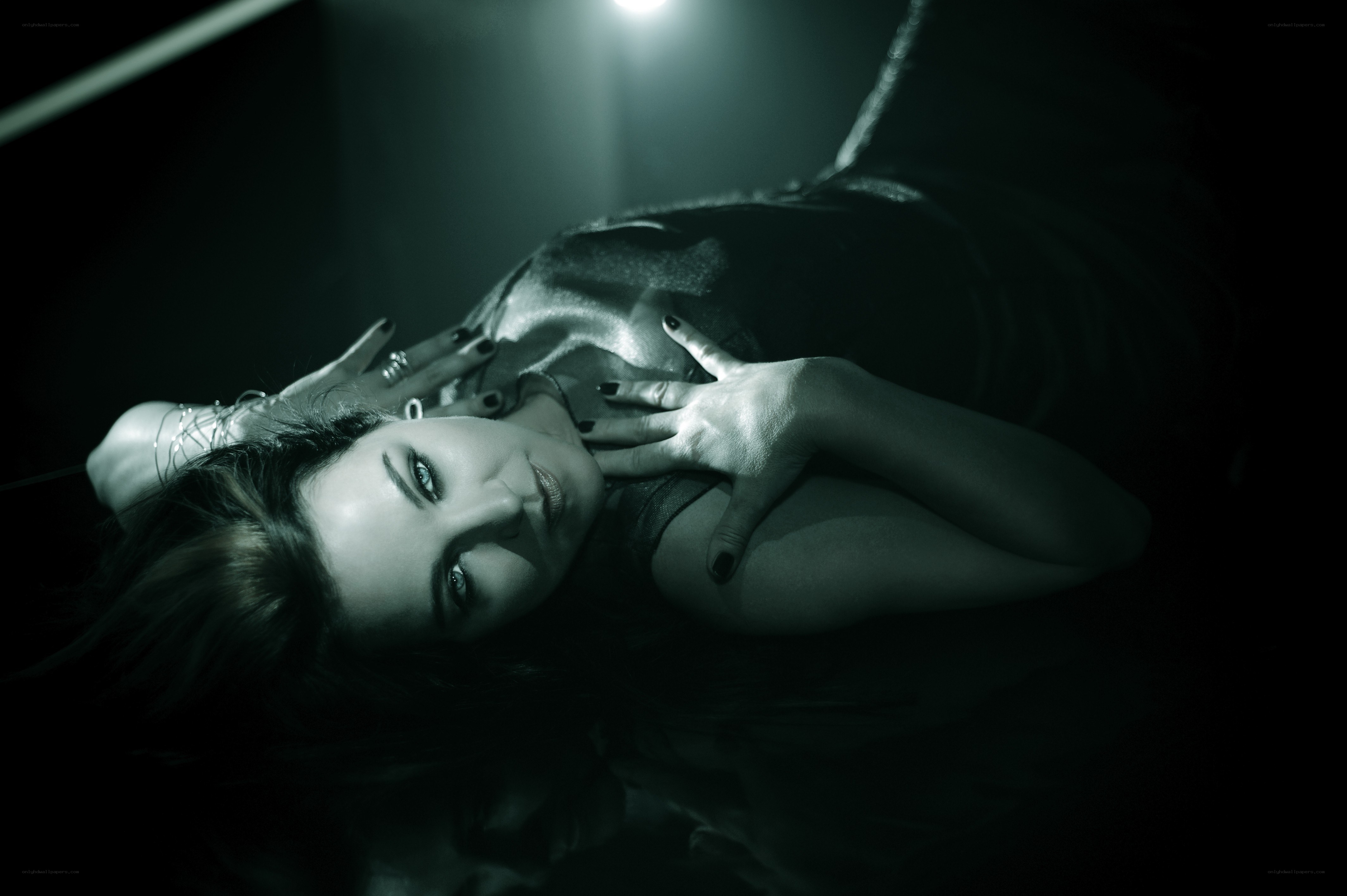 woman lying on reflective surface