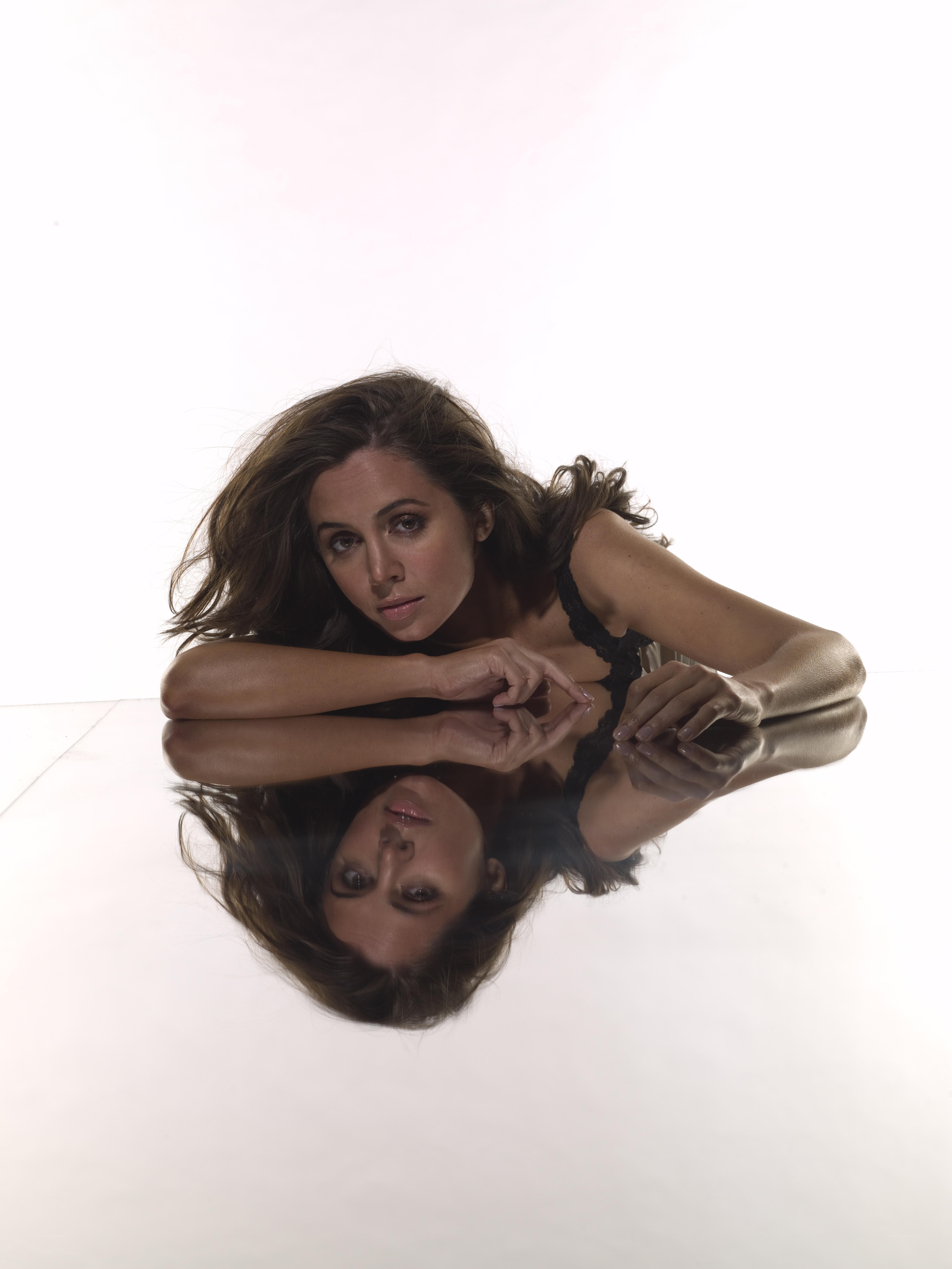 woman lying on reflective surface