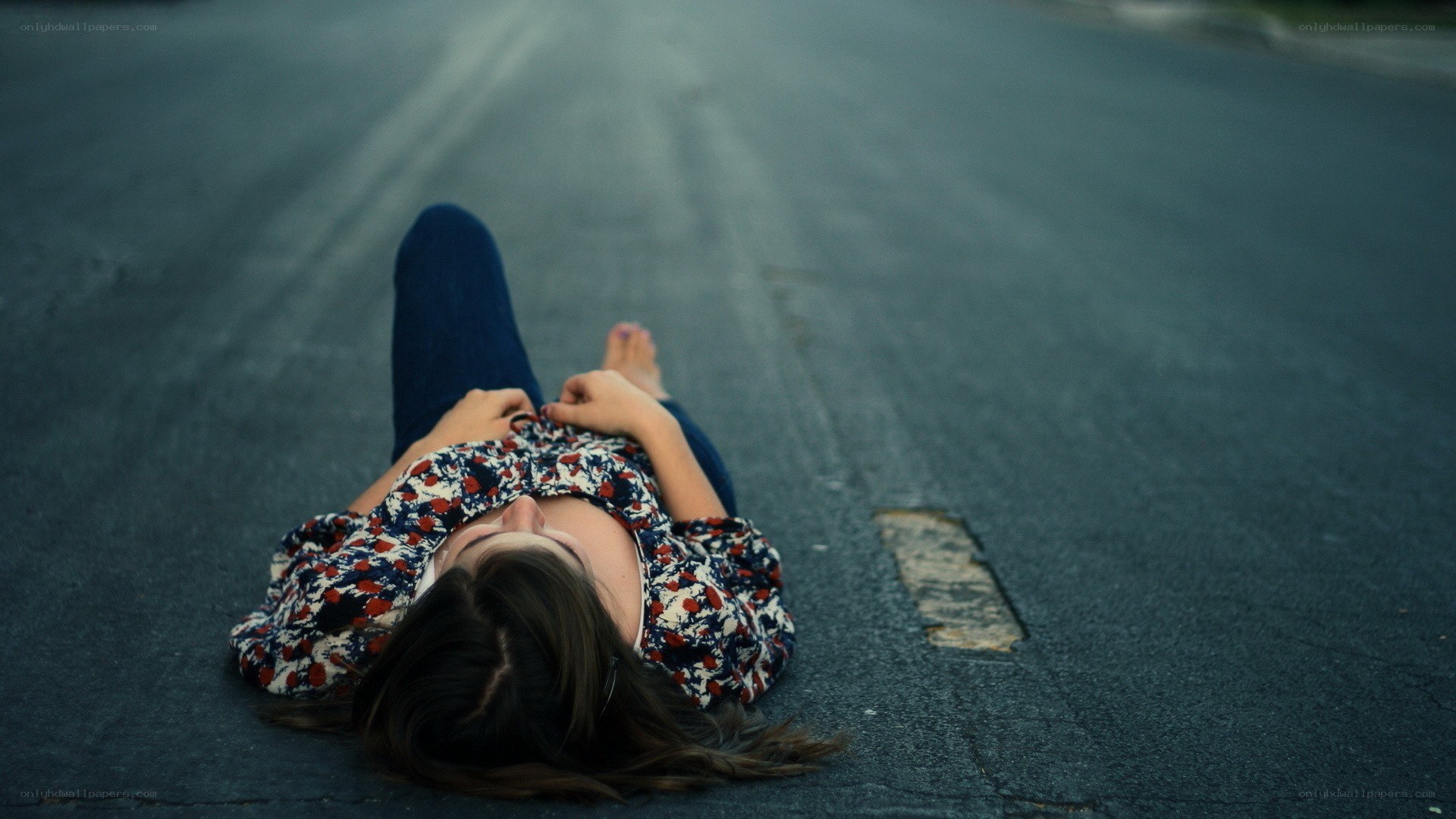 woman lying on road