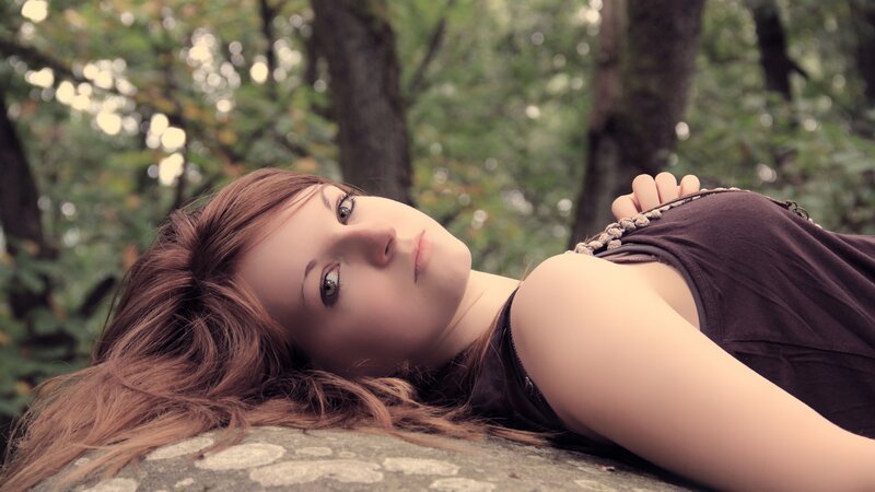 Woman Lying on Rock — Brown