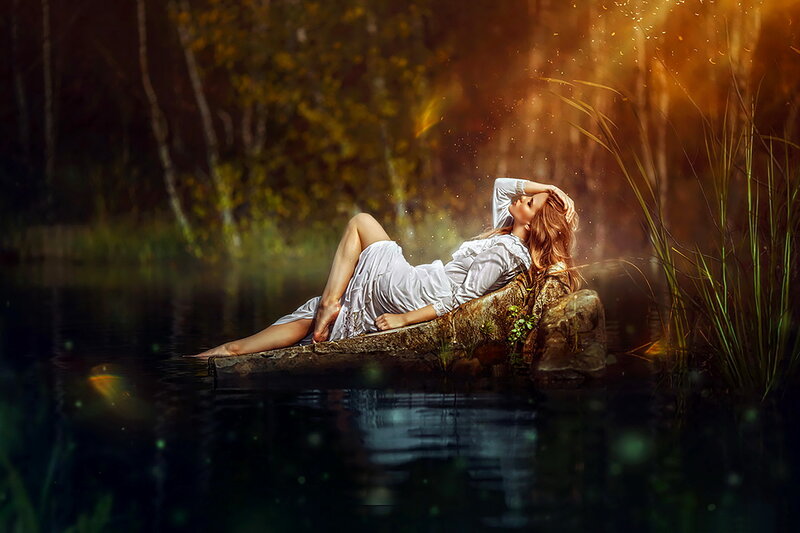 Woman Lying on Rock — White, Serene, Sunset