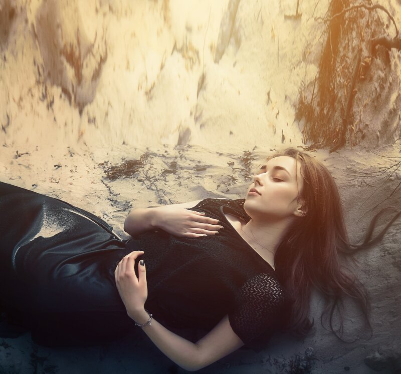 Woman Lying on Sand — Black, Serene, Sunset