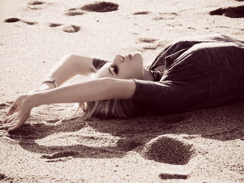 Woman Lying on Sand — Brown, Serene