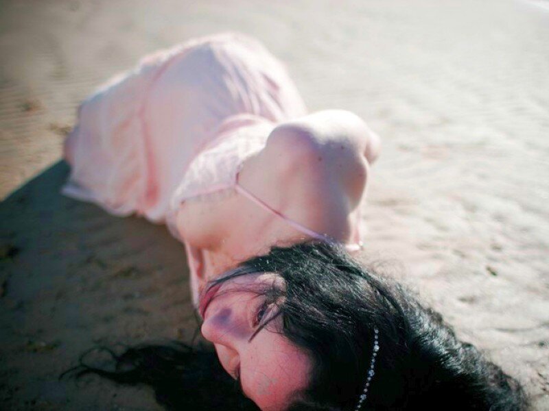 Woman Lying on Sand — Pink, Serene