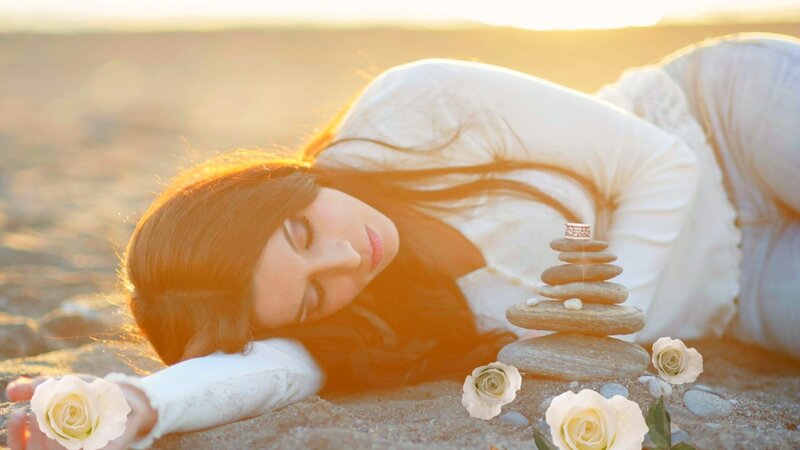 Woman Lying on Sand — White, Serene, Sunset