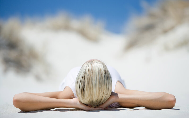 Woman Lying on Sand — White, Serene