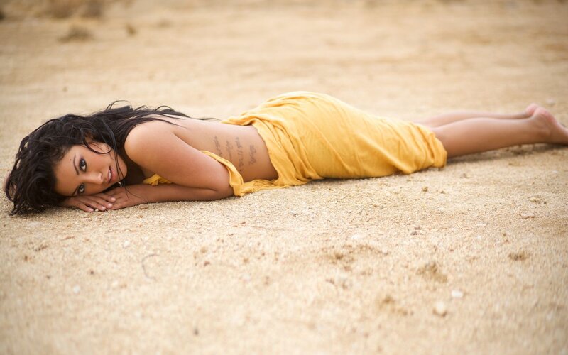 Woman Lying on Sand — Yellow