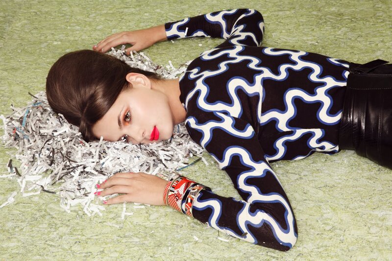 Woman Lying on Shredded Paper
